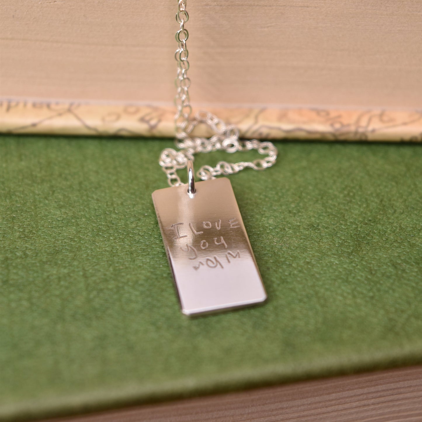 handwriting engraved on a rectangle silver necklace
