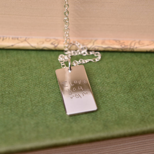 handwriting engraved on a rectangle silver necklace