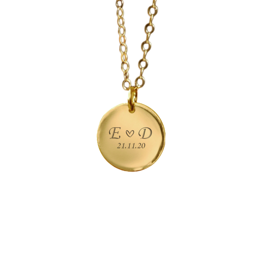 Gold necklace with a round pendant engraved with your name initials and a date. Keepsake jewellery. April Child