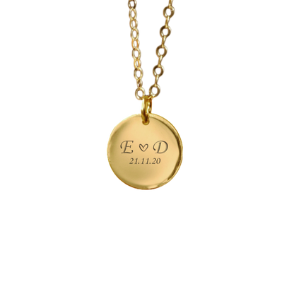 Gold necklace with a round pendant engraved with your name initials and a date. Keepsake jewellery. April Child